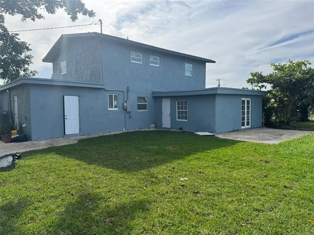 a bathroom with a shower and a sink