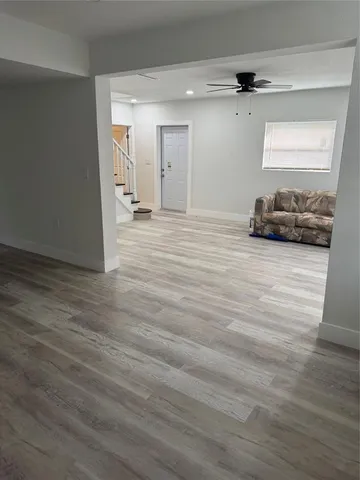 a view of a livingroom with wooden floor