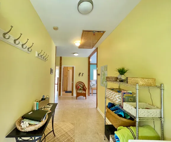 a balcony with table and chairs