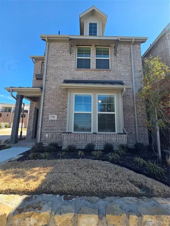 a front view of a house with stairs