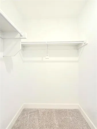 a view of a room with a wooden floor