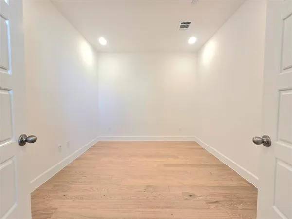 a view of an empty walk in closet