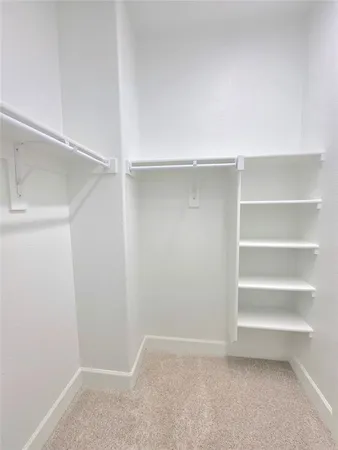 a bathroom with a tub shower and sink