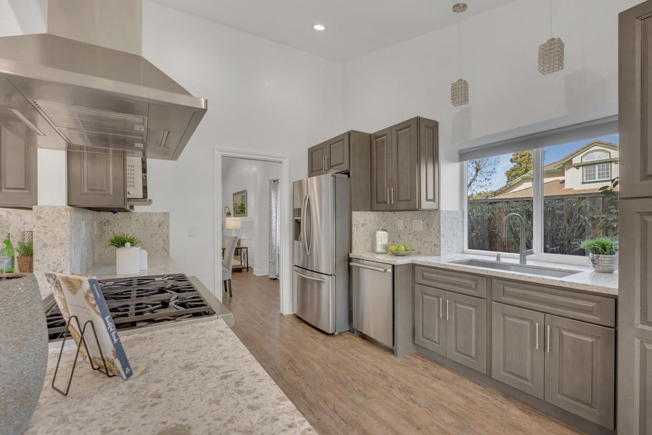 1747 Nursery Way Pleasanton, CA 94588 - Photo 12 of 50 a kitchen with stainless steel appliances a stove a refrigerator and a cabinets