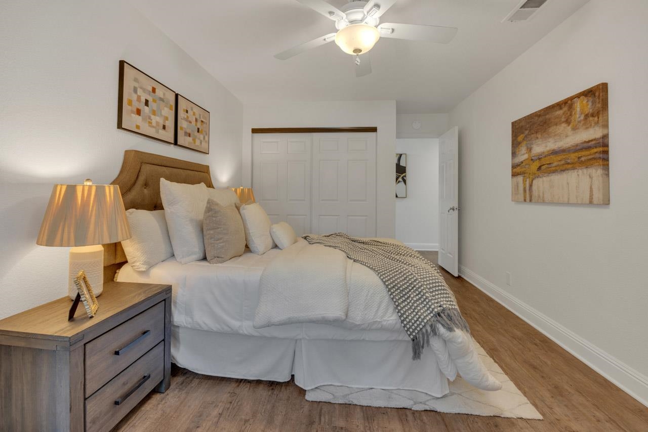 1747 Nursery Way Pleasanton, CA 94588 - Photo 22 of 50 a bedroom with a bed and a lamp on dresser