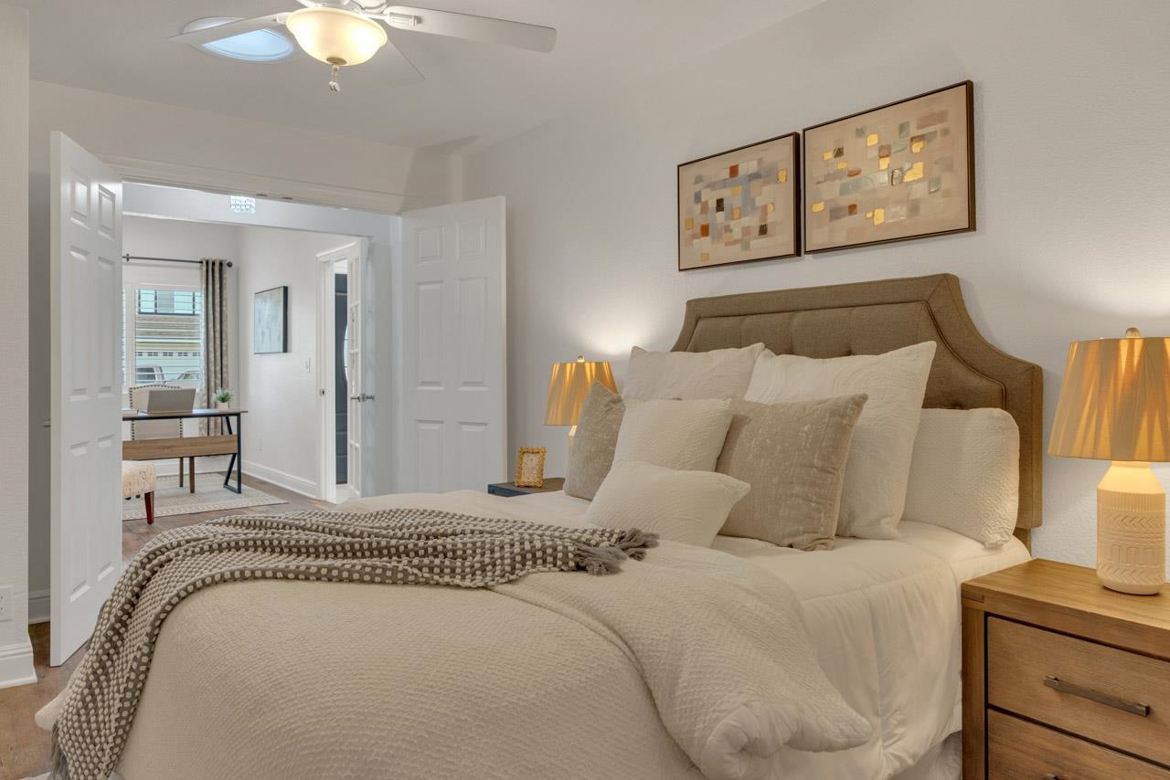 1747 Nursery Way Pleasanton, CA 94588 - Photo 23 of 50 a bedroom with a bed and lamp