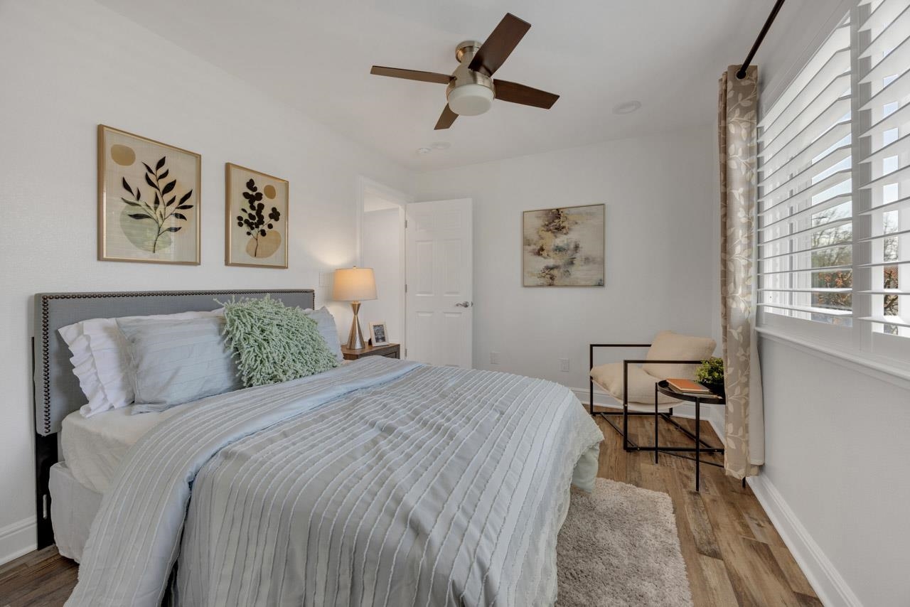 1747 Nursery Way Pleasanton, CA 94588 - Photo 25 of 50 a bedroom with a bed and a table in it with window