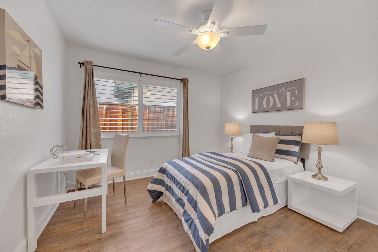 1747 Nursery Way Pleasanton, CA 94588 - Photo 30 of 50 a bedroom with a bed and a table in it with window