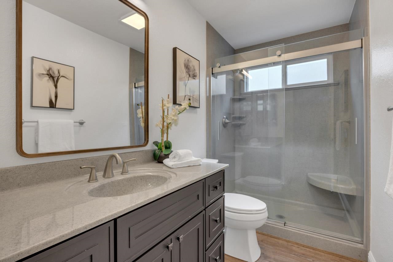 1747 Nursery Way Pleasanton, CA 94588 - Photo 31 of 50 a bathroom with a sink a toilet and shower