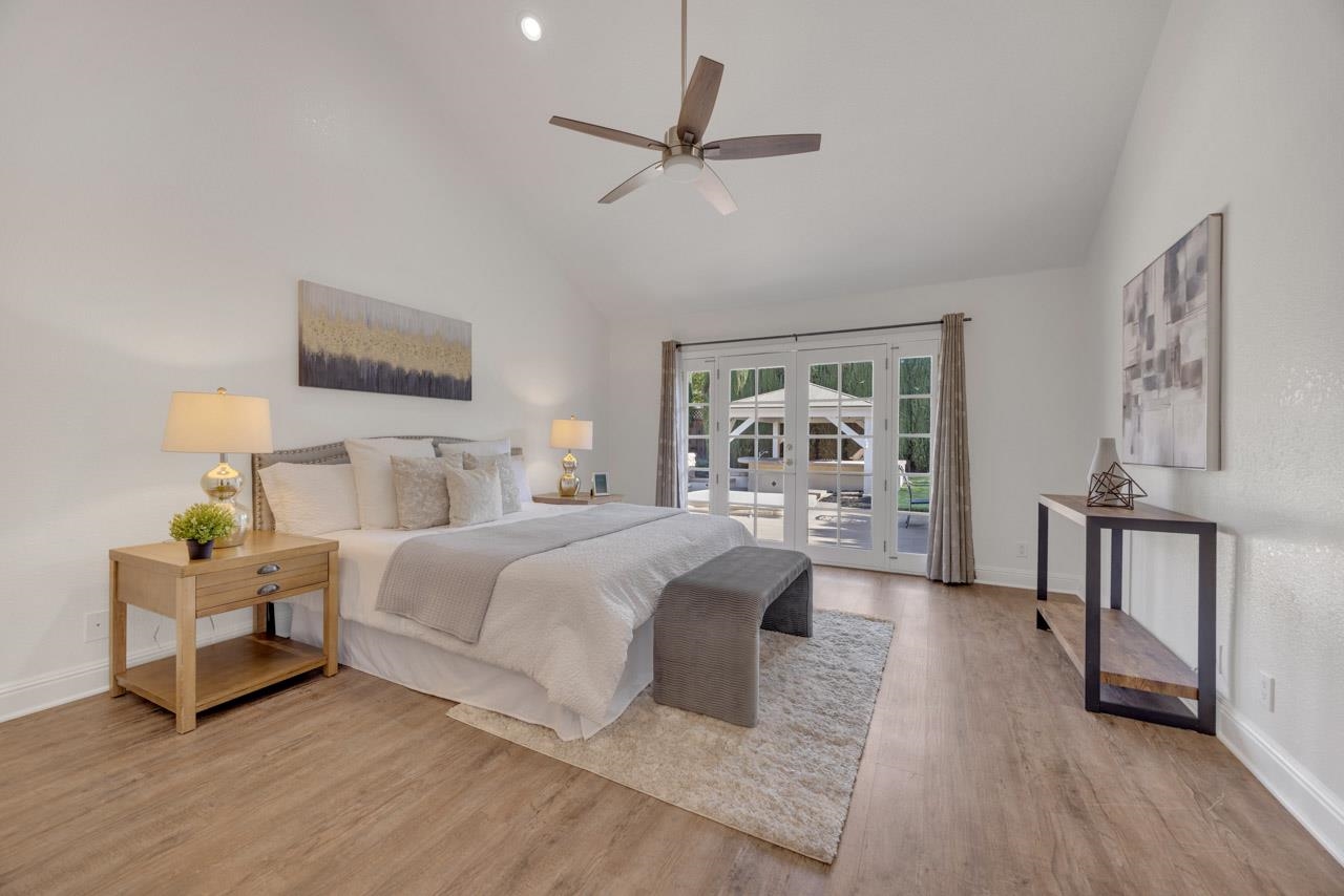 1747 Nursery Way Pleasanton, CA 94588 - Photo 33 of 50 a spacious bedroom with a bed a couch and a window