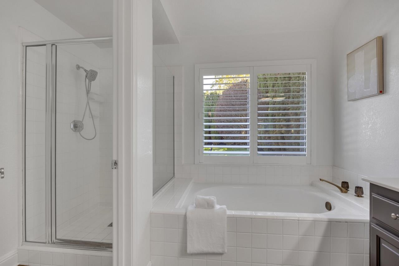 1747 Nursery Way Pleasanton, CA 94588 - Photo 38 of 50 a bathroom with a tub a shower and a window