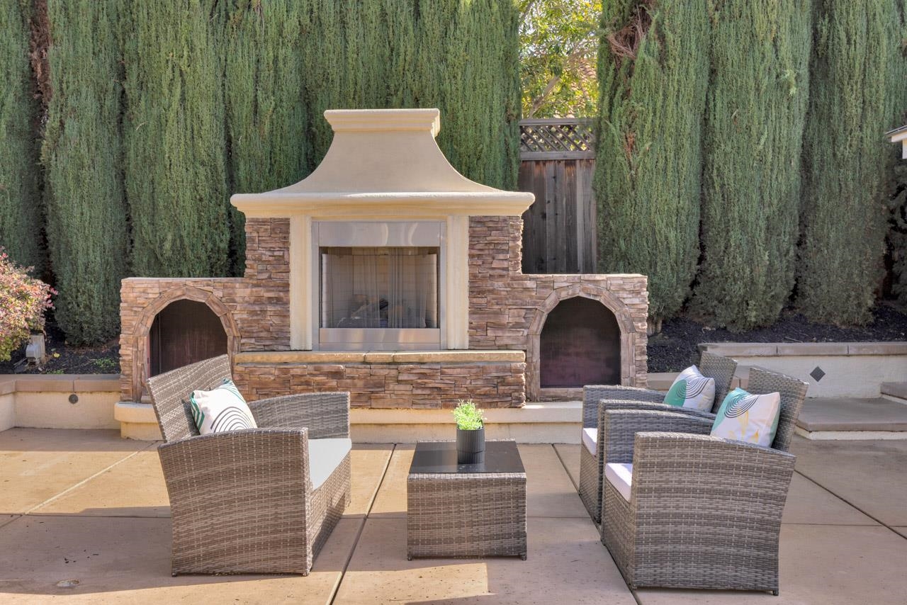 1747 Nursery Way Pleasanton, CA 94588 - Photo 44 of 50 a living room with furniture a fireplace and a potted plant