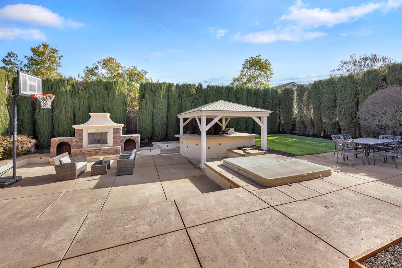 1747 Nursery Way Pleasanton, CA 94588 - Photo 45 of 50 a view of a patio with a table and chairs under an umbrella