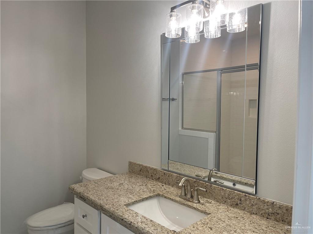 5515 North Crown Point Pharr, TX 78577 - Photo 11 of 15 Bathroom with vanity and a stall shower