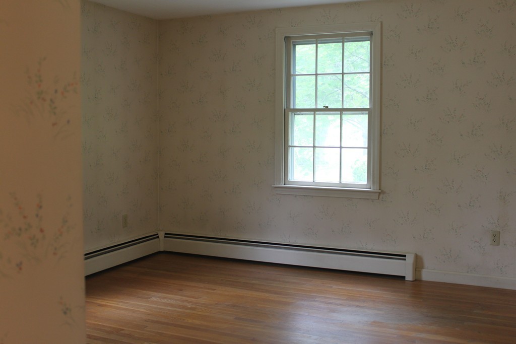 13 Haverhill Road Topsfield, MA 01983 - Photo 11 of 20 a view of a room with wooden floor and a window
