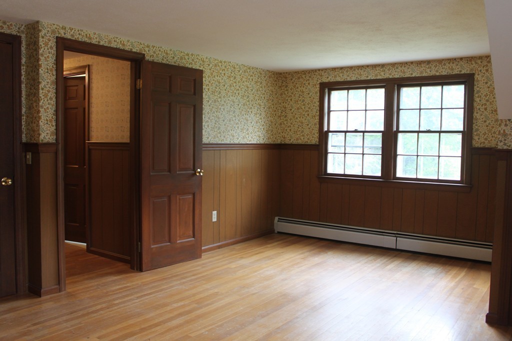 13 Haverhill Road Topsfield, MA 01983 - Photo 14 of 20 an empty room with wooden floor and windows