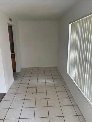 a white bath tub sitting next to a white toilet and sink