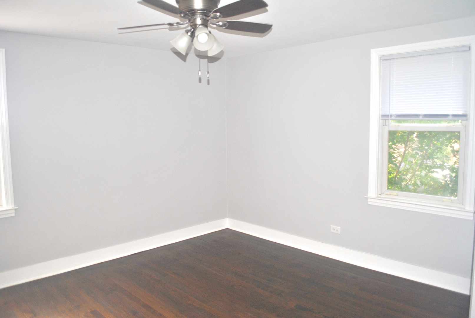 10052 South Green Street Chicago, IL 60643 - Photo 12 of 22 an empty room with wooden floor and windows