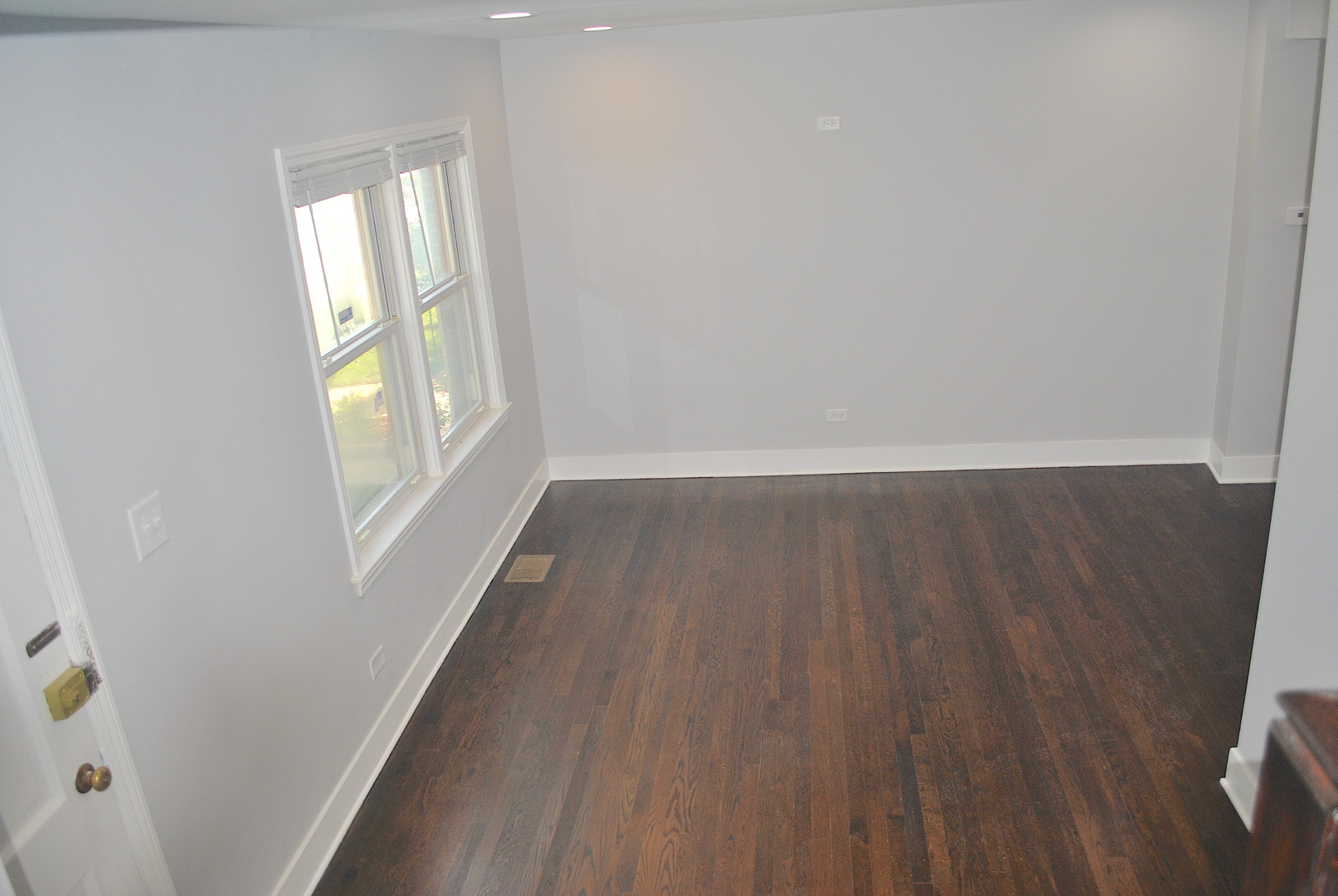 10052 South Green Street Chicago, IL 60643 - Photo 10 of 22 an empty room with wooden floor and windows