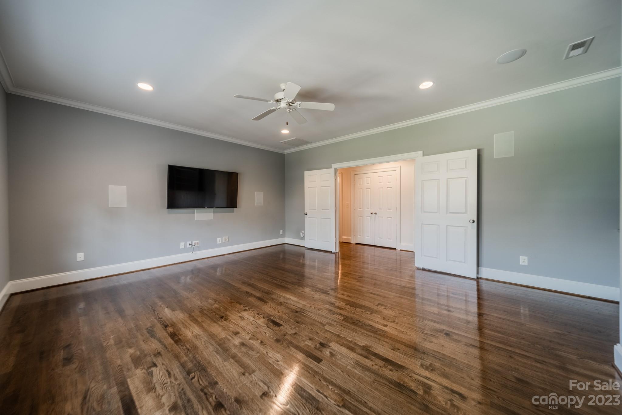 2810 Sharon Road Charlotte, NC 28211 - Photo 23 of 37 a view of an empty room with wooden floor and windows