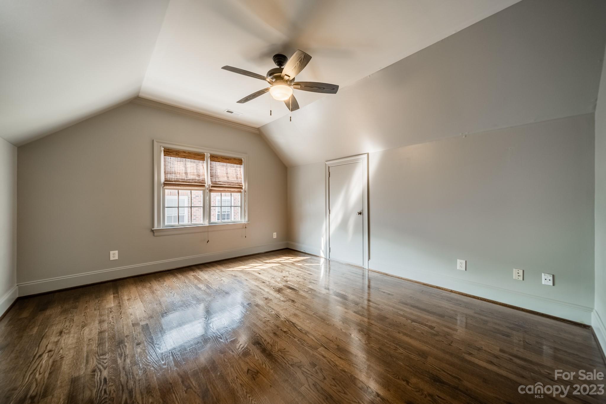 2810 Sharon Road Charlotte, NC 28211 - Photo 30 of 37 wooden floor in an empty room with a window