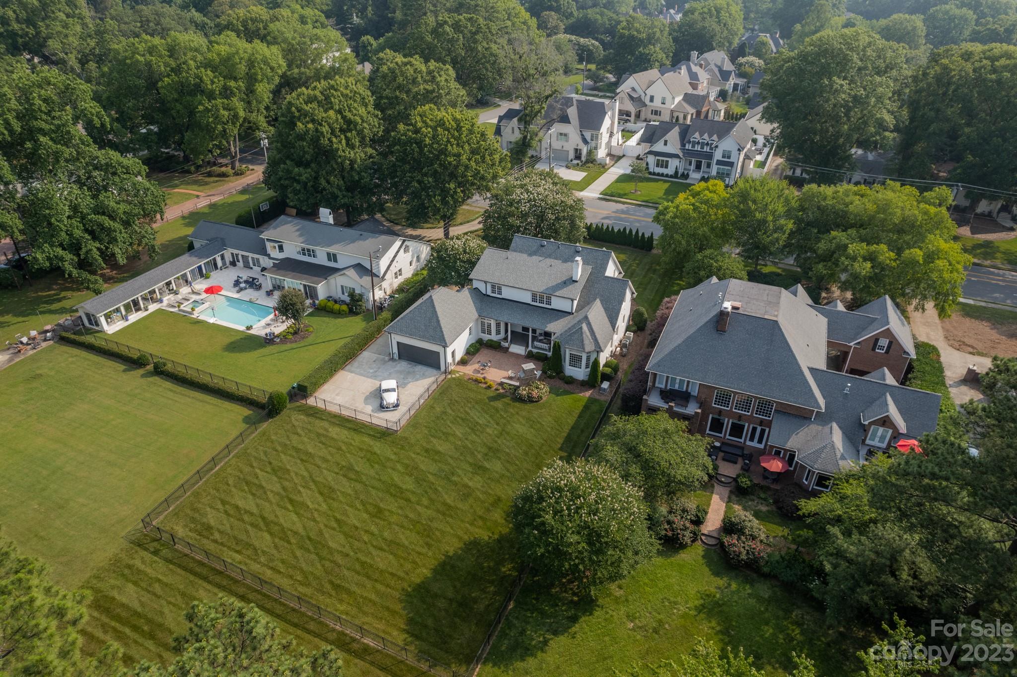 2810 Sharon Road Charlotte, NC 28211 - Photo 32 of 37 an aerial view of a house with a garden and lake view