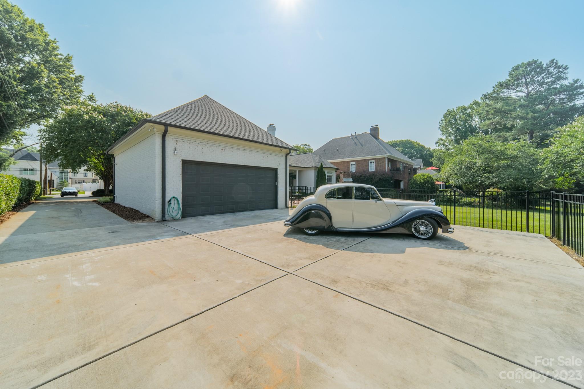 2810 Sharon Road Charlotte, NC 28211 - Photo 35 of 37 a car parked in front of a house