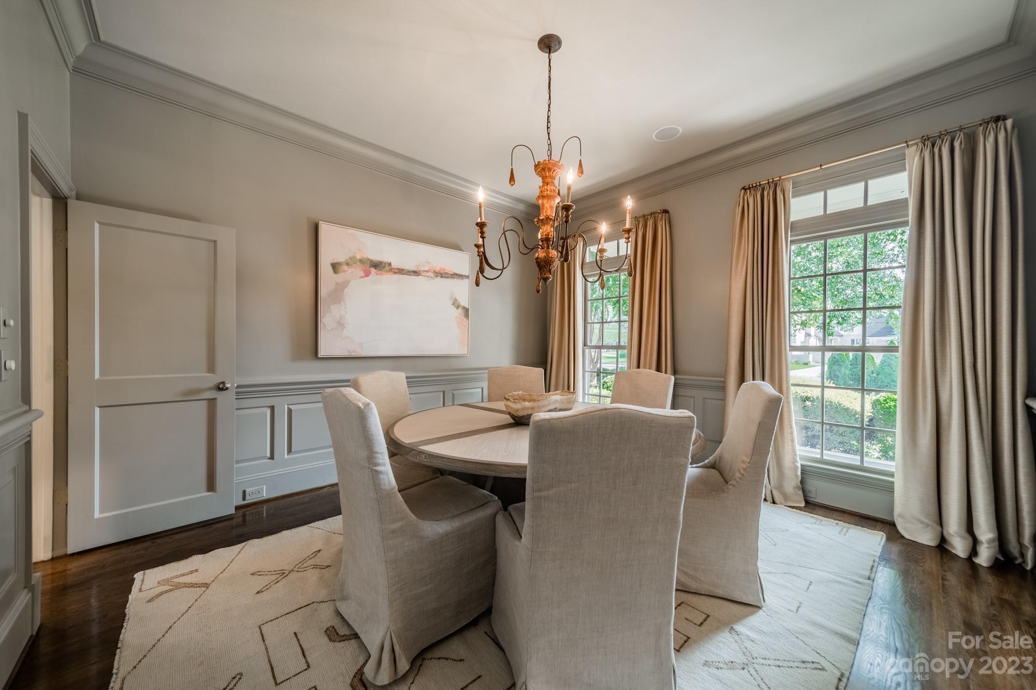 2810 Sharon Road Charlotte, NC 28211 - Photo 6 of 37 a dining room with furniture a chandelier and window