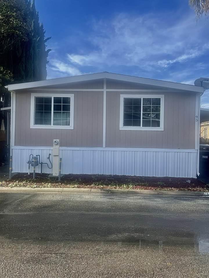 200 Ford Road, Unit 95 San Jose, CA 95138 - Photo 1 of 13 a view of a house with a yard