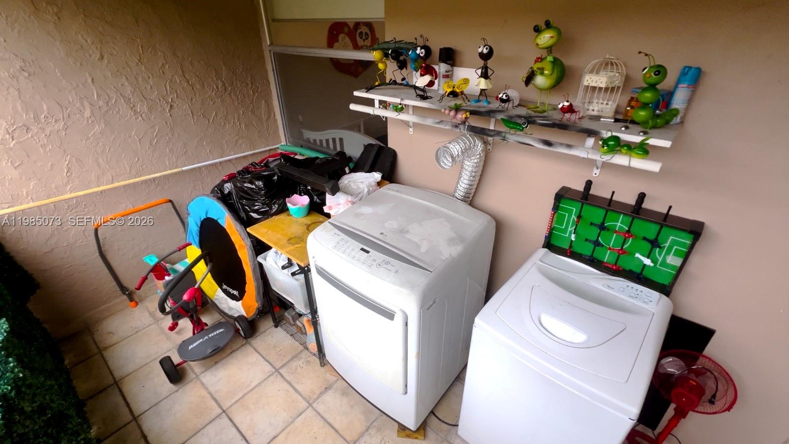 1900 West 68th Street, Unit D207 Hialeah, FL 33014 - Photo 10 of 33 a utility room with toys and toys