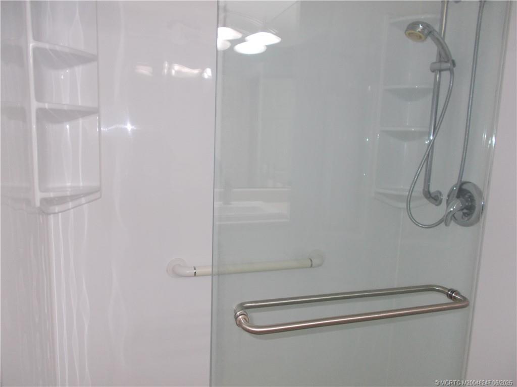 4761 Southeast Binnacle Way, Unit 108 Stuart, FL 34997 - Photo 19 of 43 a bathroom with a shower