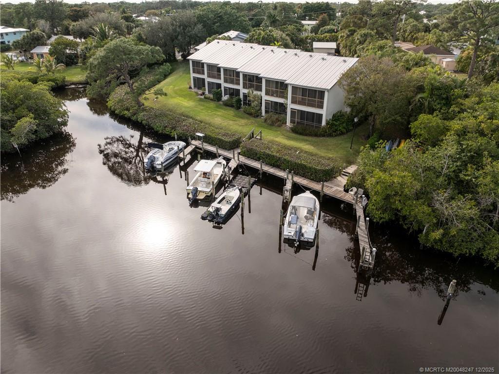 4761 Southeast Binnacle Way, Unit 108 Stuart, FL 34997 - Photo 27 of 43 an aerial view of a house with yard swimming pool and outdoor seating