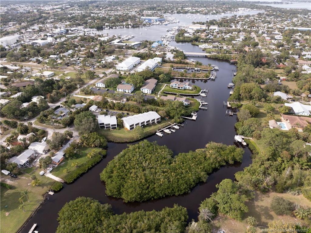 4761 Southeast Binnacle Way, Unit 108 Stuart, FL 34997 - Photo 32 of 43 an aerial view of a residential houses with outdoor space and trees