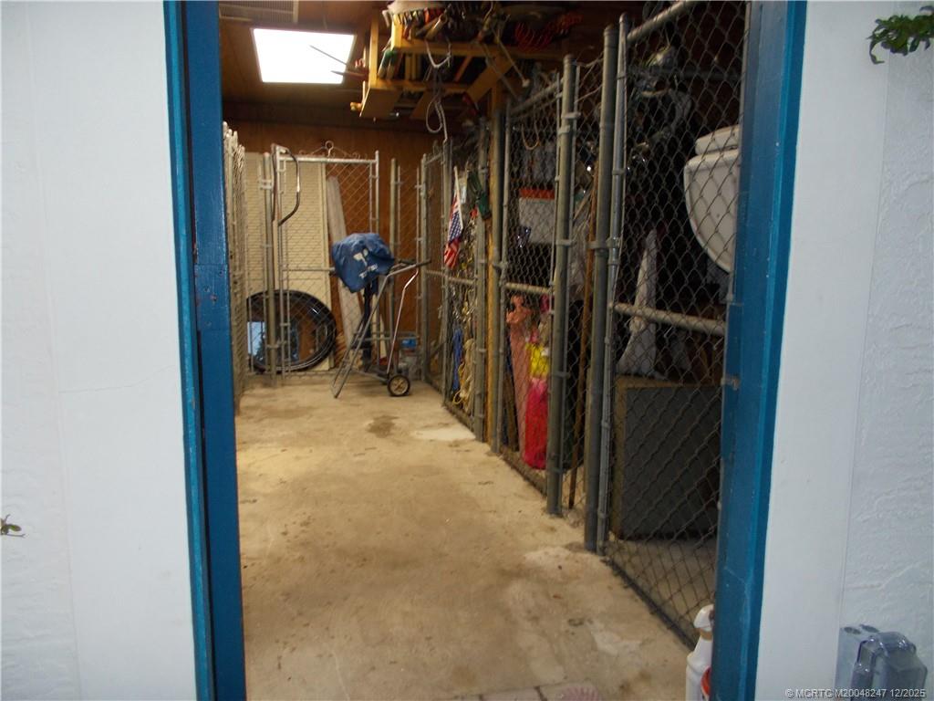 4761 Southeast Binnacle Way, Unit 108 Stuart, FL 34997 - Photo 38 of 43 a view of walk in closet with clothes and shoes