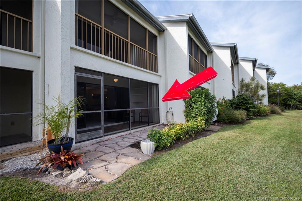 4761 Southeast Binnacle Way, Unit 108 Stuart, FL 34997 - Photo 41 of 43 a house view with a backyard space