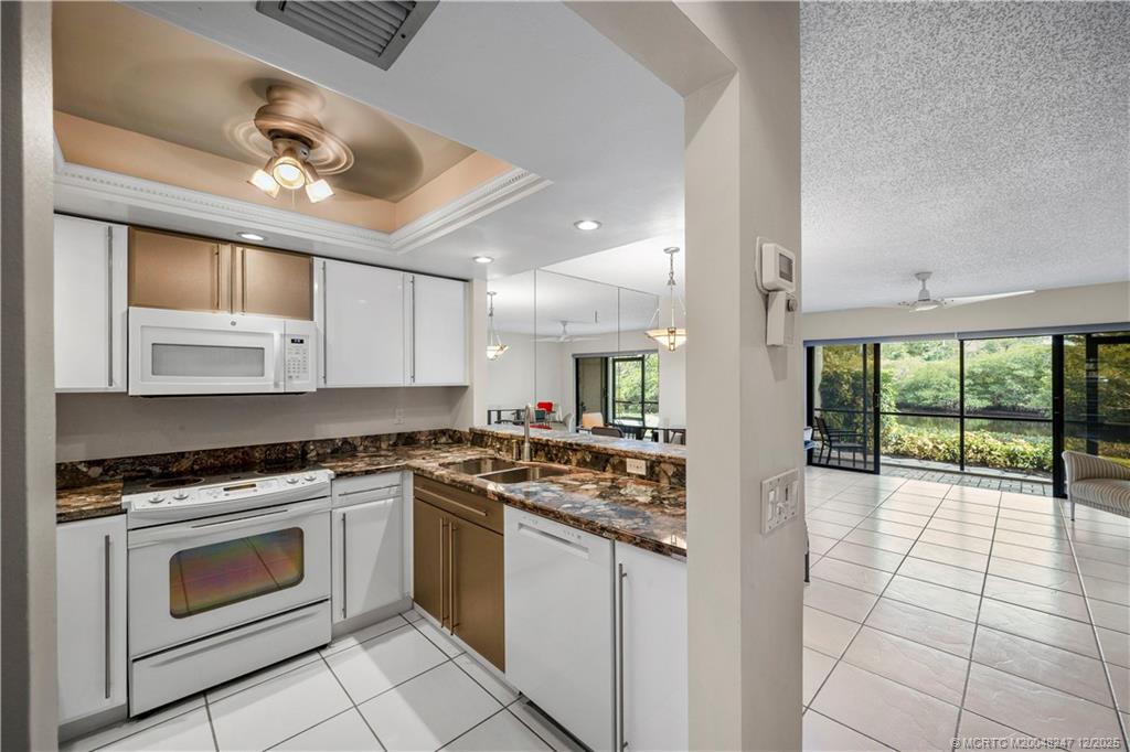 4761 Southeast Binnacle Way, Unit 108 Stuart, FL 34997 - Photo 8 of 43 Lovely tiled main level with views of the water