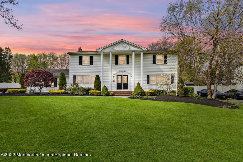298 Elton Adelphia Road Freehold, NJ 07728 - Photo 1 of 48 a front view of a house with a garden and yard