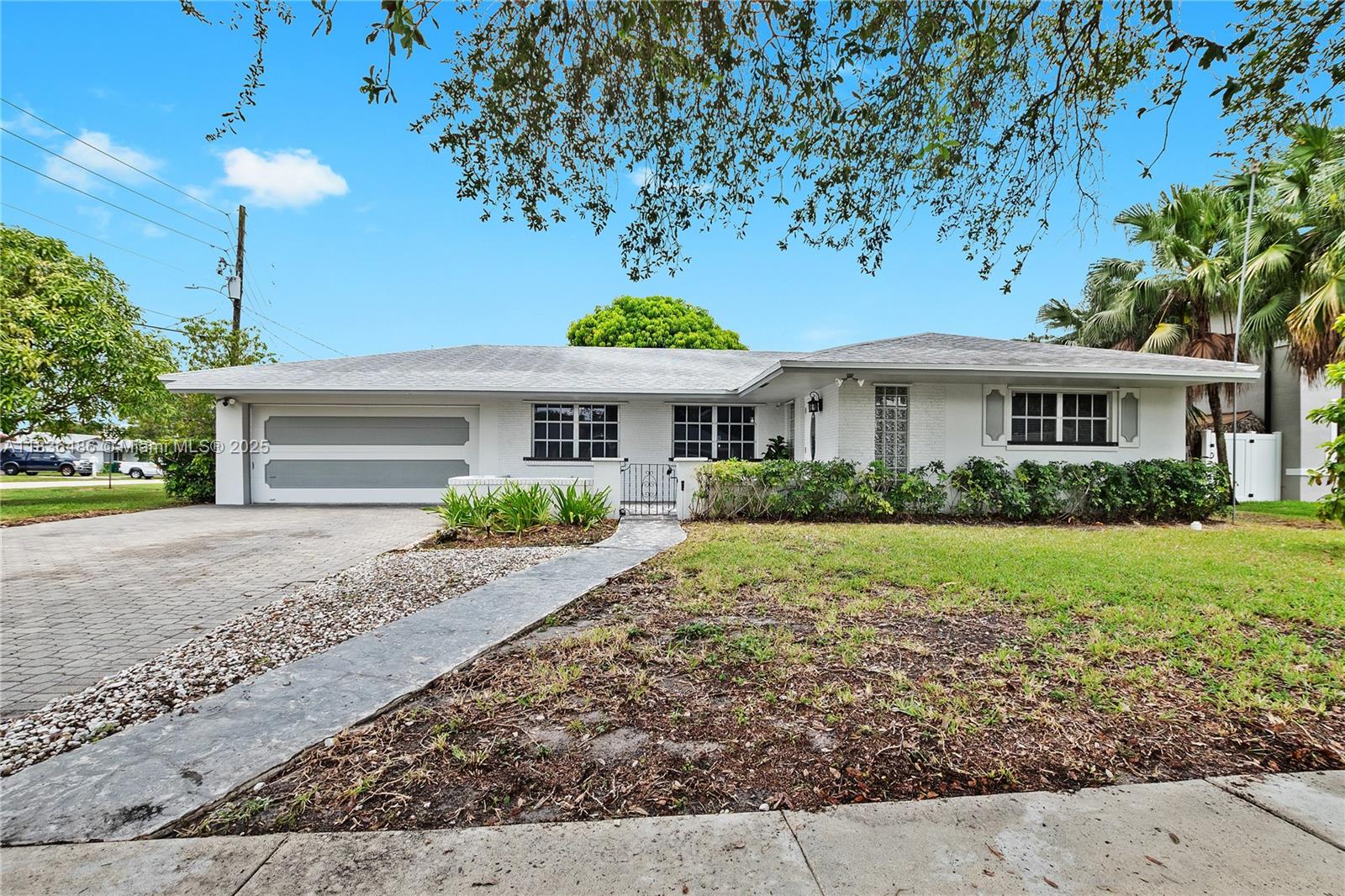 180 Southwest 125th Avenue Plantation, FL 33325 - Photo 1 of 29 a front view of a house with a yard