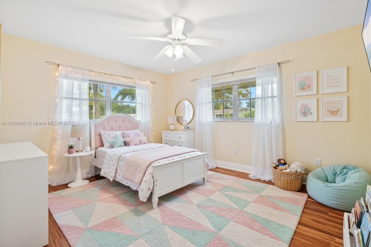 180 Southwest 125th Avenue Plantation, FL 33325 - Photo 16 of 29 a bedroom with a bed couch and window
