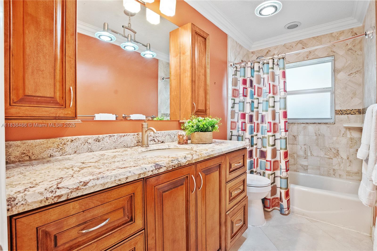 180 Southwest 125th Avenue Plantation, FL 33325 - Photo 19 of 29 a bathroom with a granite countertop sink and a bathtub