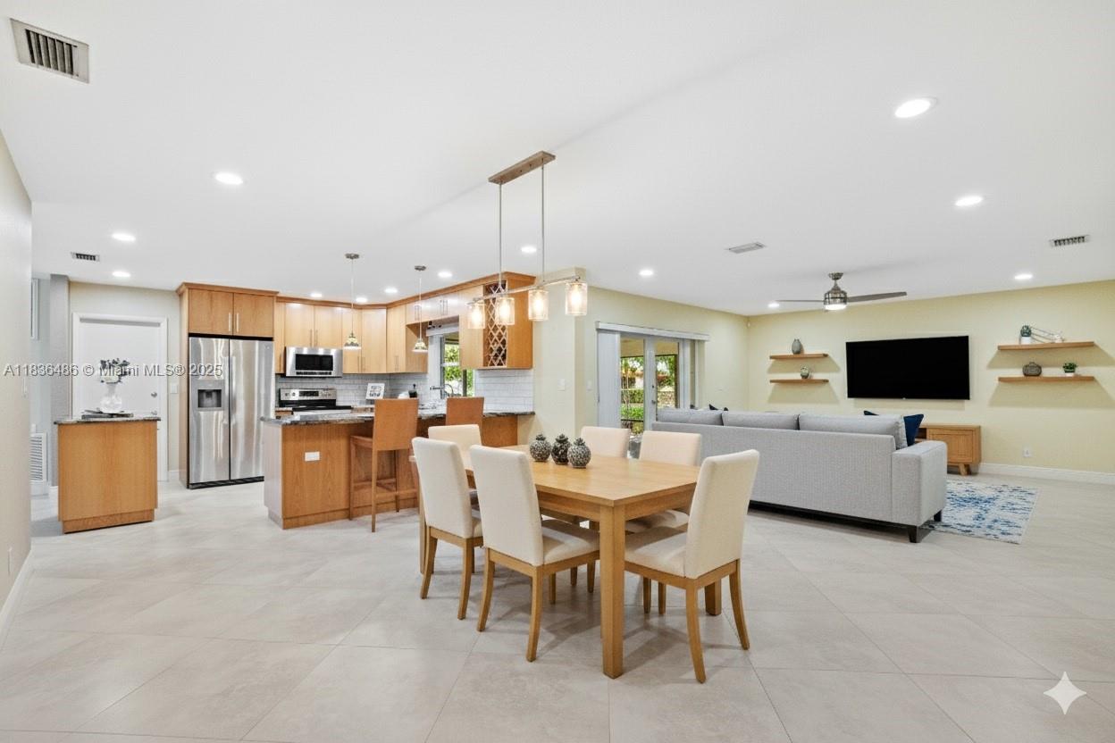 180 Southwest 125th Avenue Plantation, FL 33325 - Photo 2 of 29 a view of kitchen with livingroom and furniture