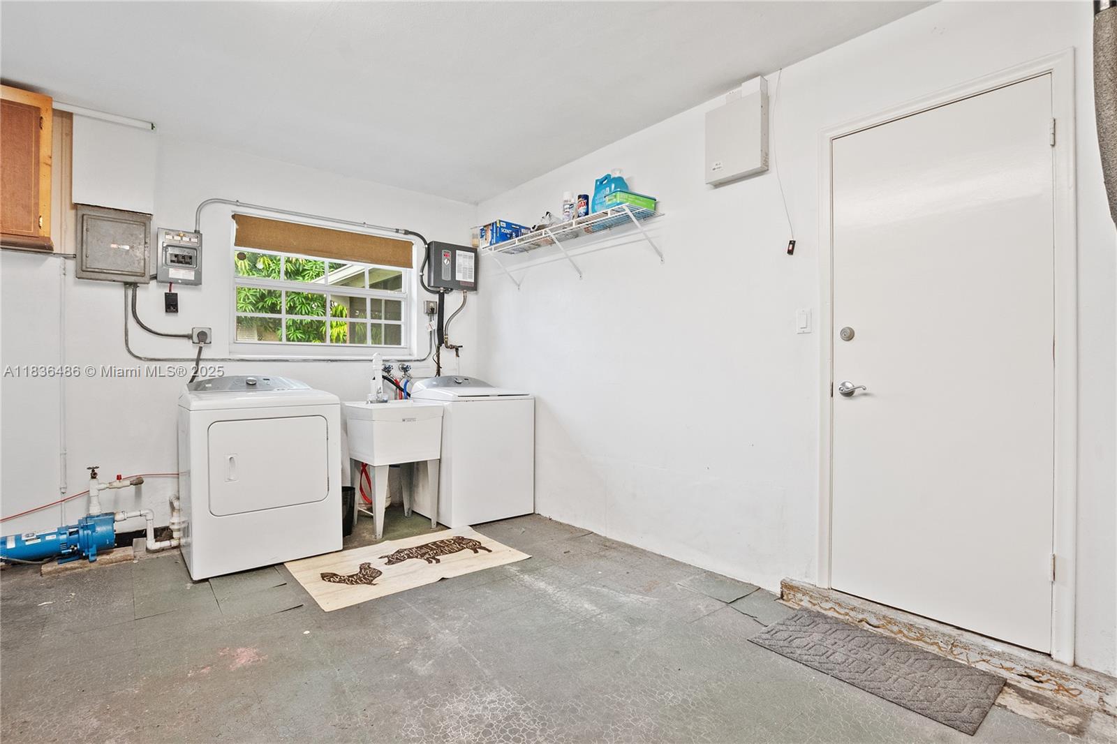 180 Southwest 125th Avenue Plantation, FL 33325 - Photo 23 of 29 a utility room with cabinets washer and dryer