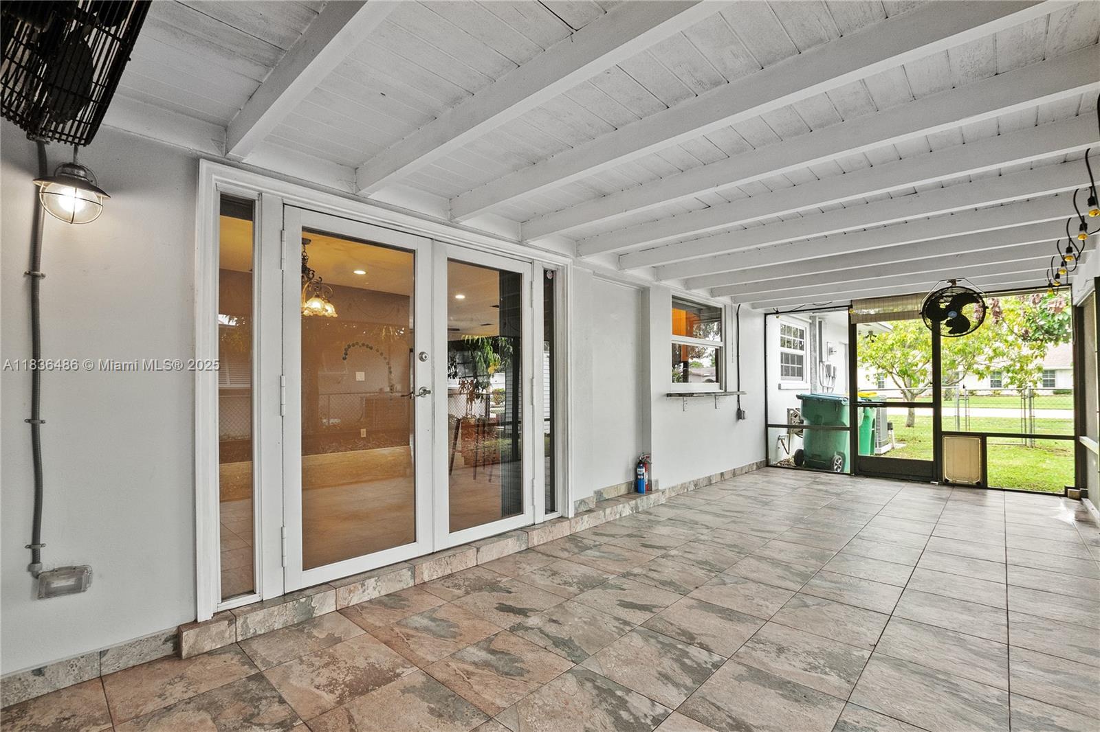180 Southwest 125th Avenue Plantation, FL 33325 - Photo 24 of 29 a view of an empty room with large windows