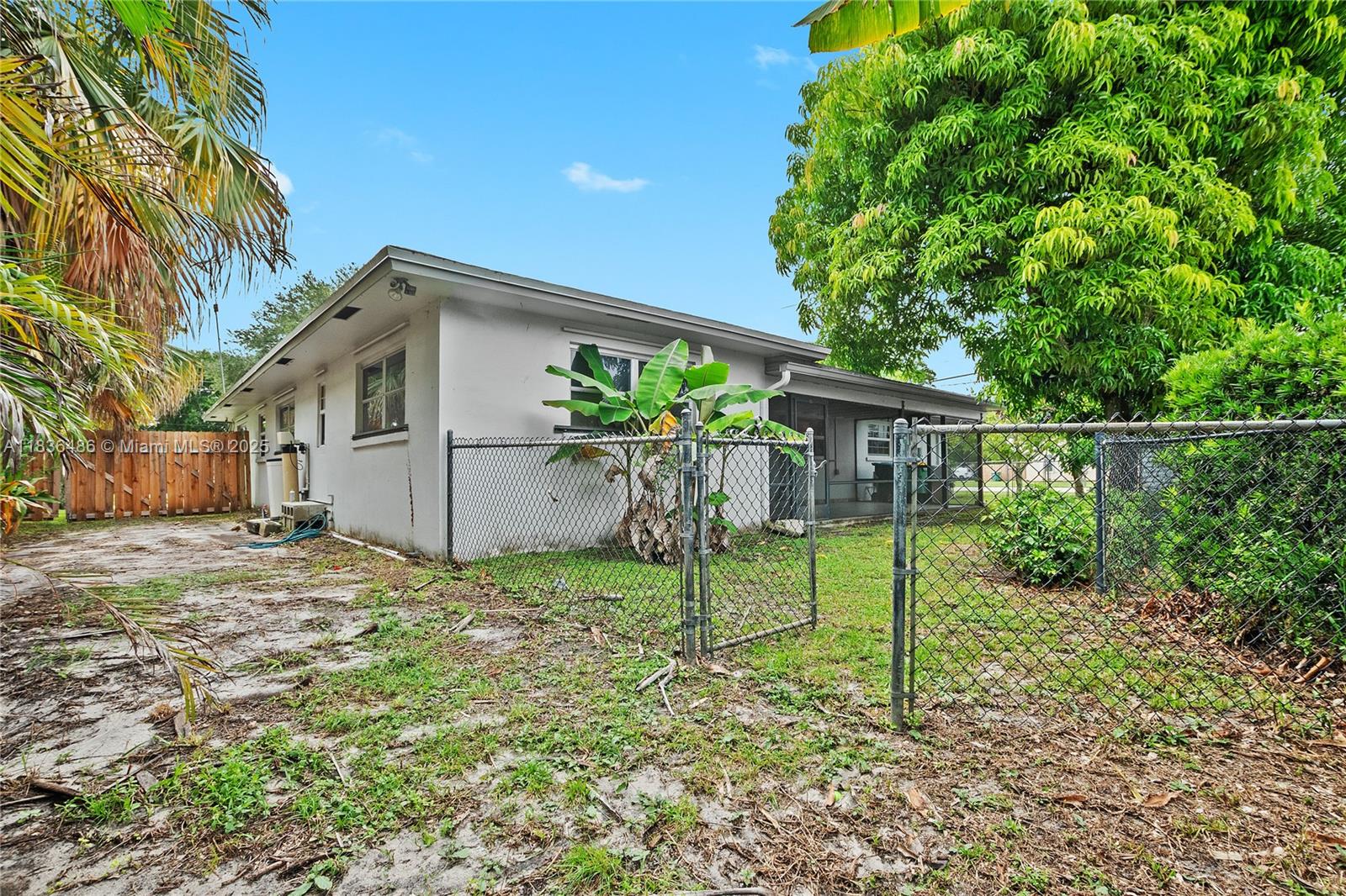 180 Southwest 125th Avenue Plantation, FL 33325 - Photo 28 of 29 a house view with a garden space
