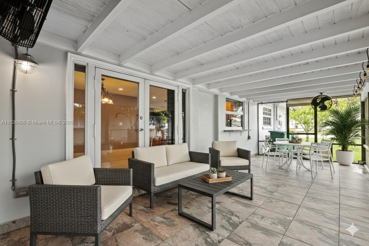 180 Southwest 125th Avenue Plantation, FL 33325 - Photo 4 of 29 a living room with furniture and a table