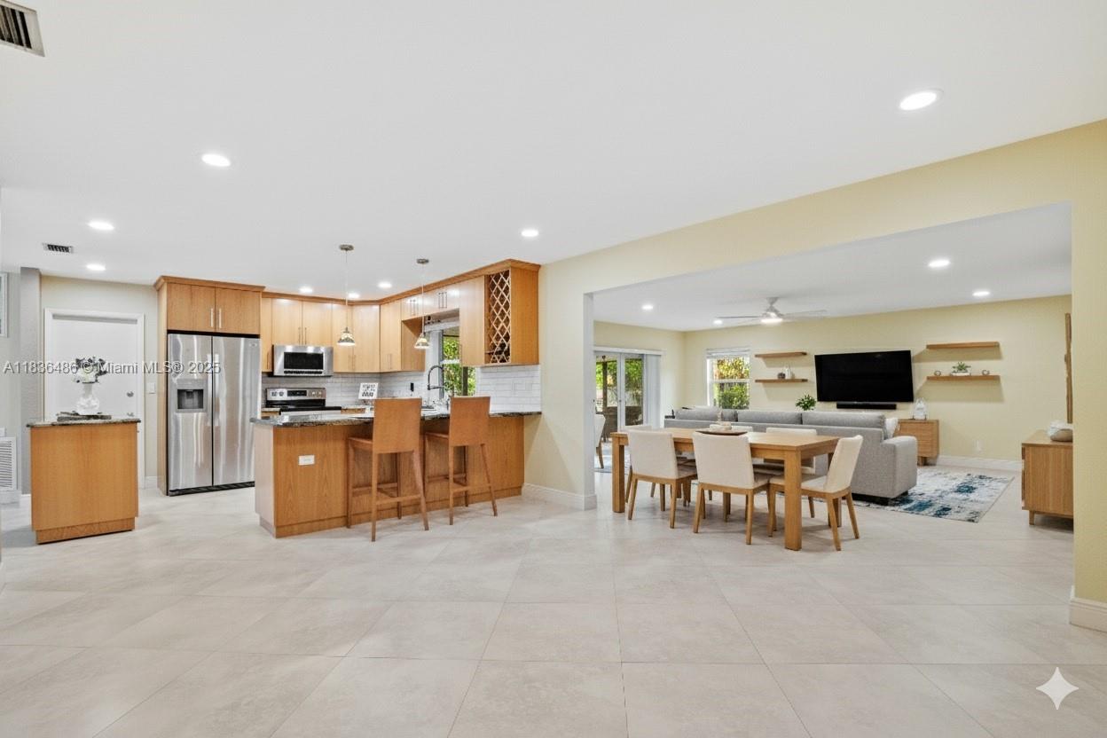 180 Southwest 125th Avenue Plantation, FL 33325 - Photo 7 of 29 a living room with lots of furniture and kitchen view
