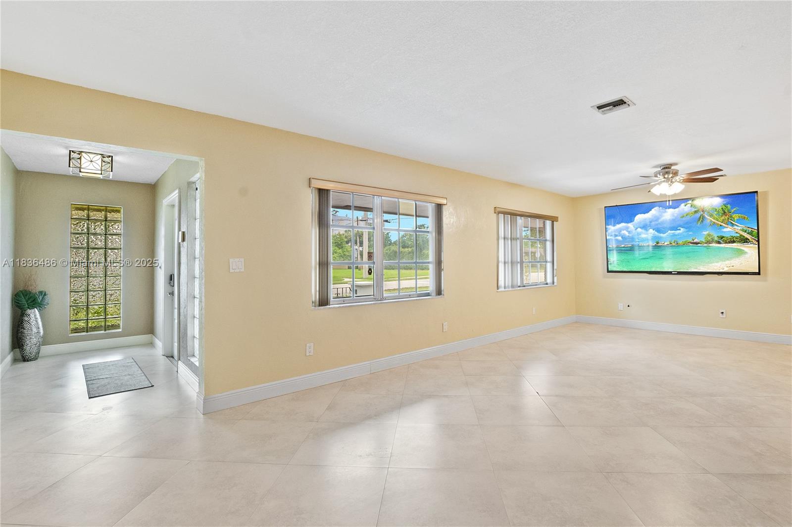 180 Southwest 125th Avenue Plantation, FL 33325 - Photo 8 of 29 an empty room with windows