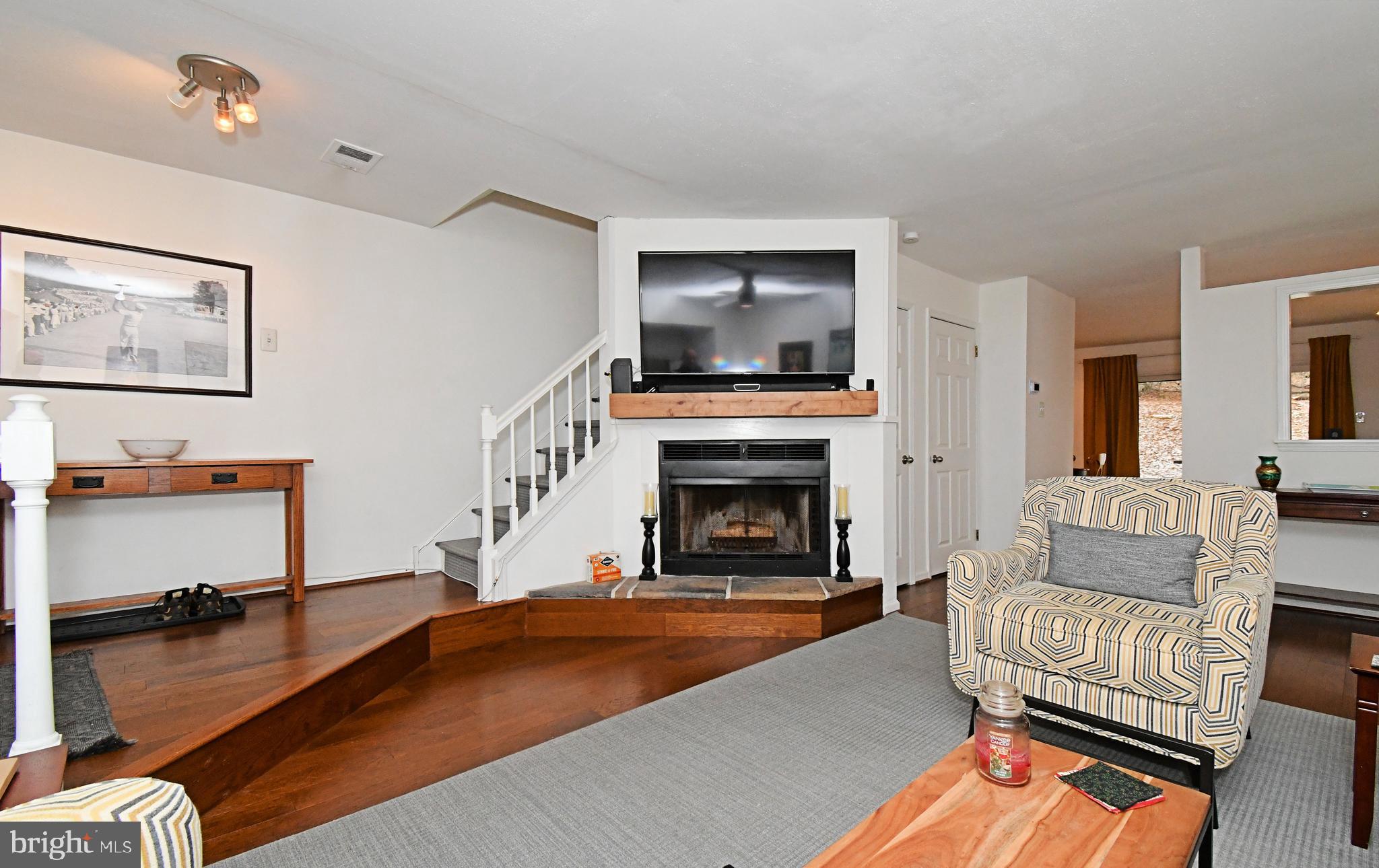 28 Flintlock Lane Chesterbrook, PA 19087 - Photo 12 of 69 a living room with furniture and a fireplace