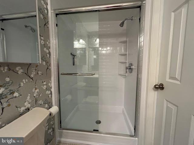 28 Flintlock Lane Chesterbrook, PA 19087 - Photo 23 of 69 a bathroom with a shower and a sink a mirror