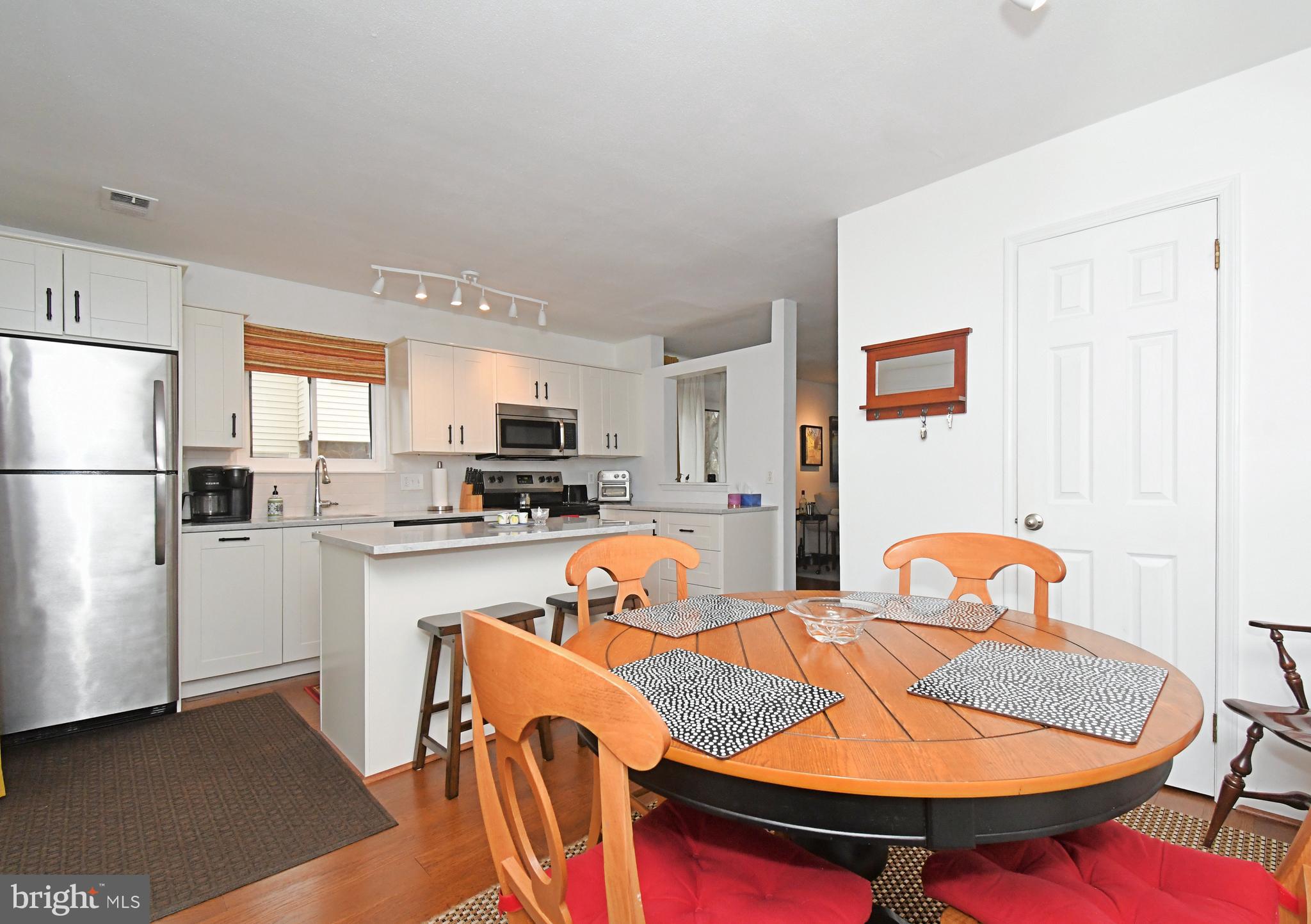 28 Flintlock Lane Chesterbrook, PA 19087 - Photo 44 of 69 a kitchen with stainless steel appliances granite countertop a dining table and chairs